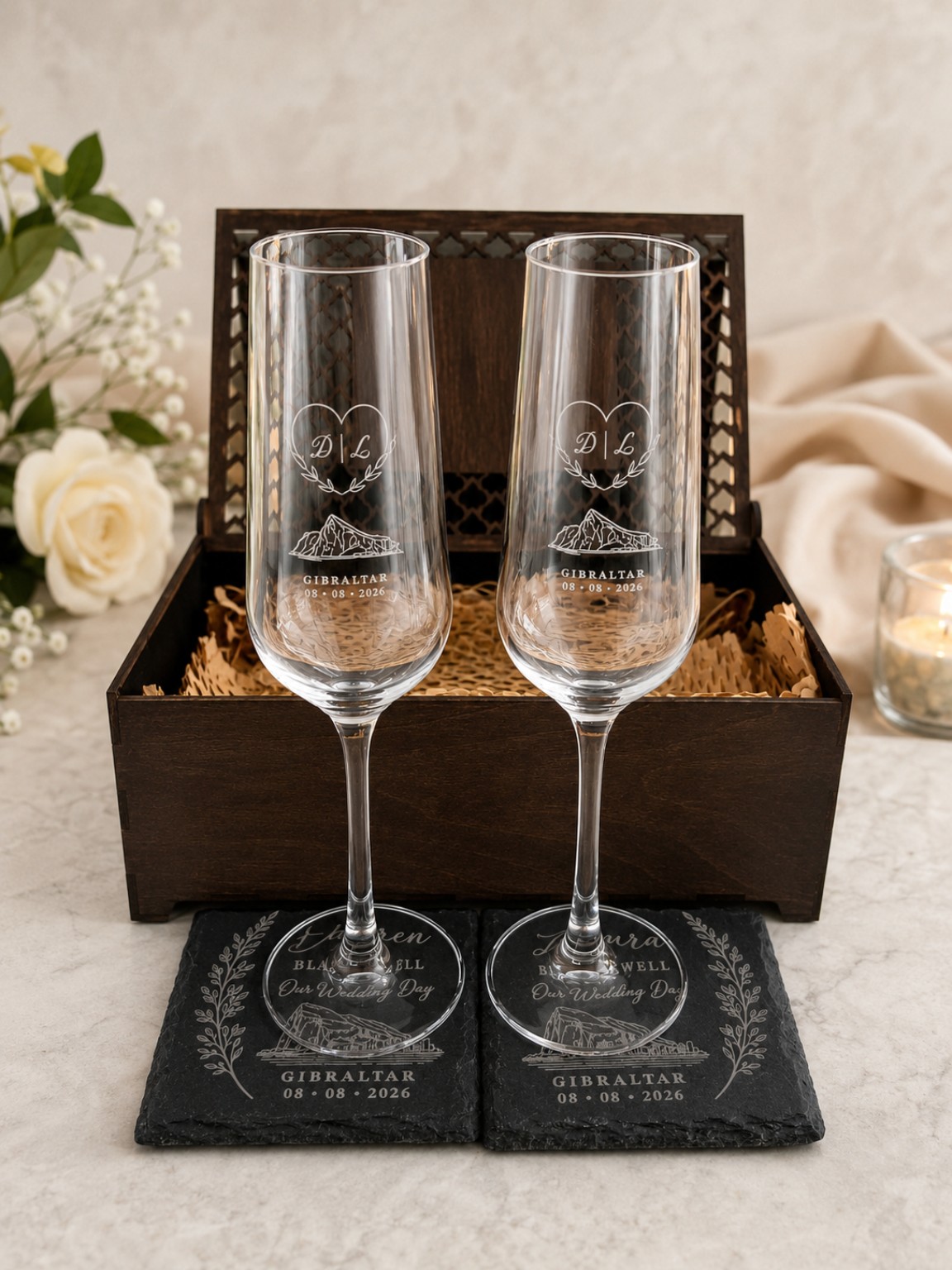 Personalised glass flutes and engraved slate coasters with a wooden presentation box